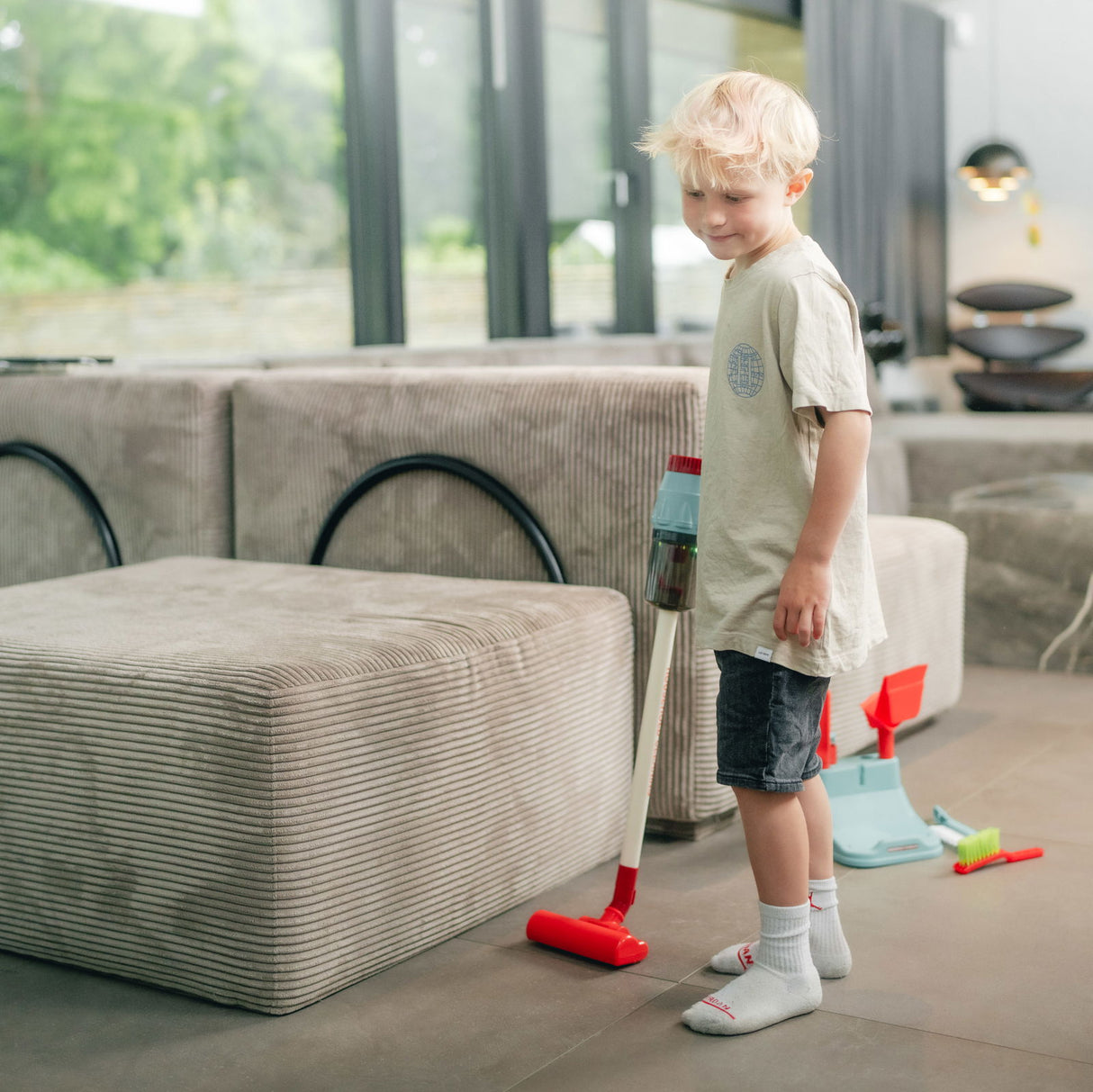 Legetøjsstøvsuger med lys og lyd