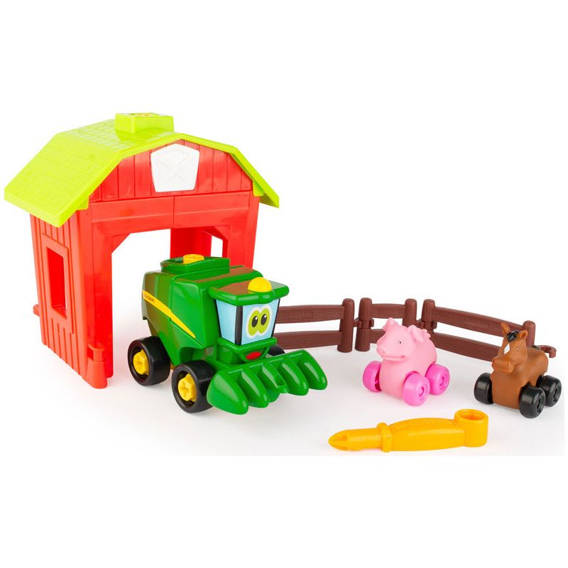 John Deere bondegaard med mejetærsker, gris og ko på hjul.